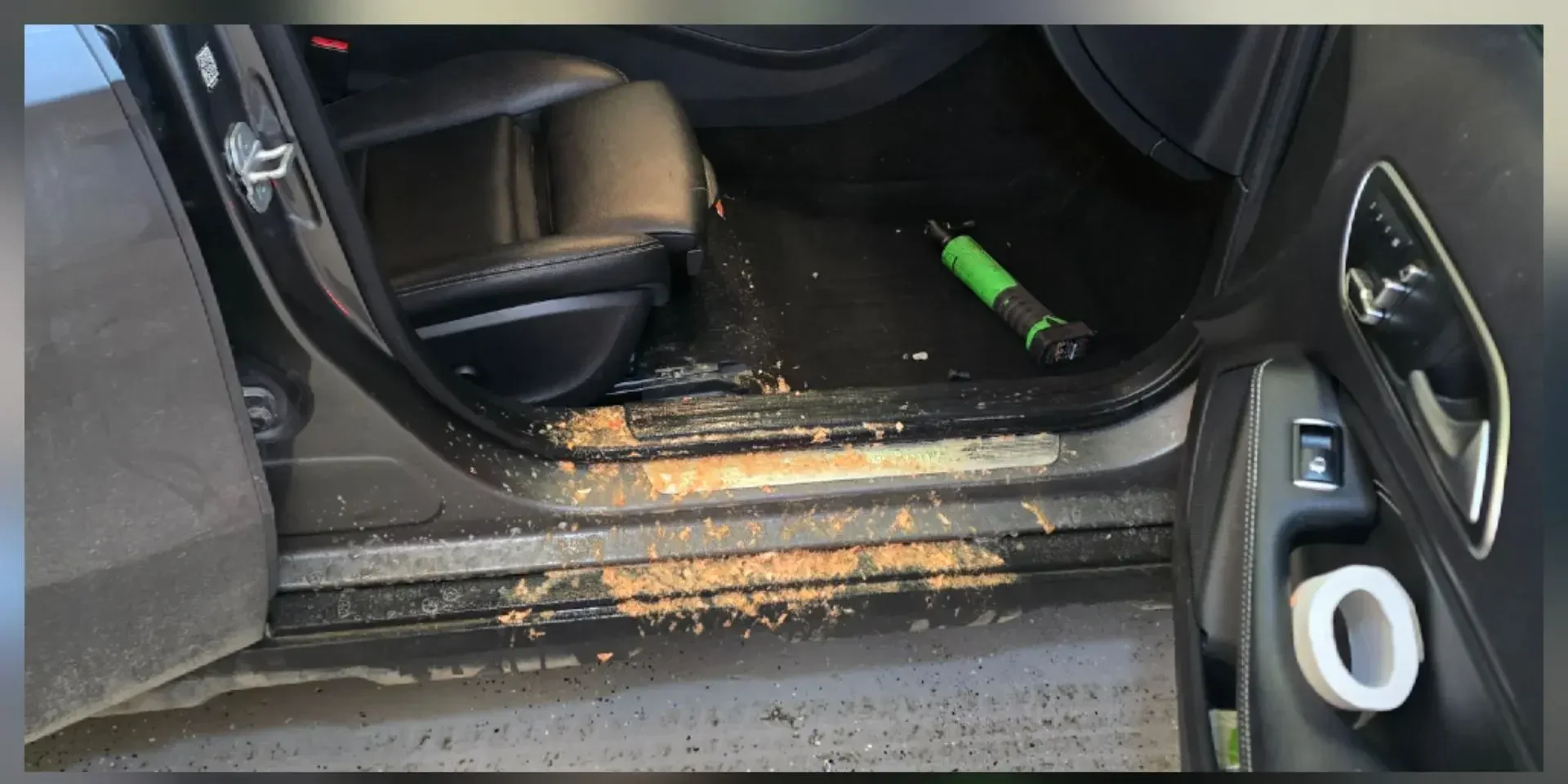 Mercedes door sill and carpet covered in food residue before contamination removal
