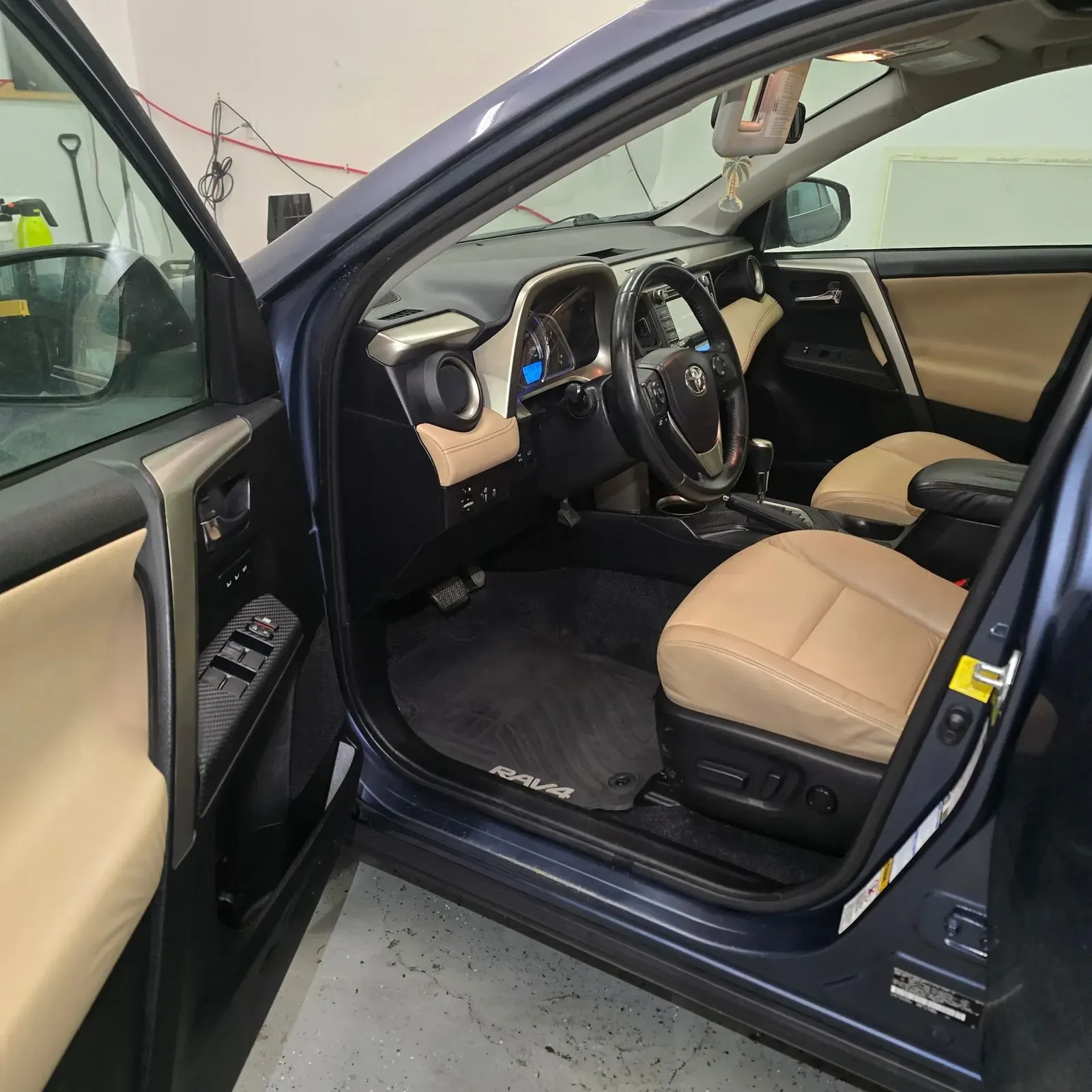 Toyota RAV4 driver area with clean carpet, mat and door sill after interior detailing in Anchorage, Alaska