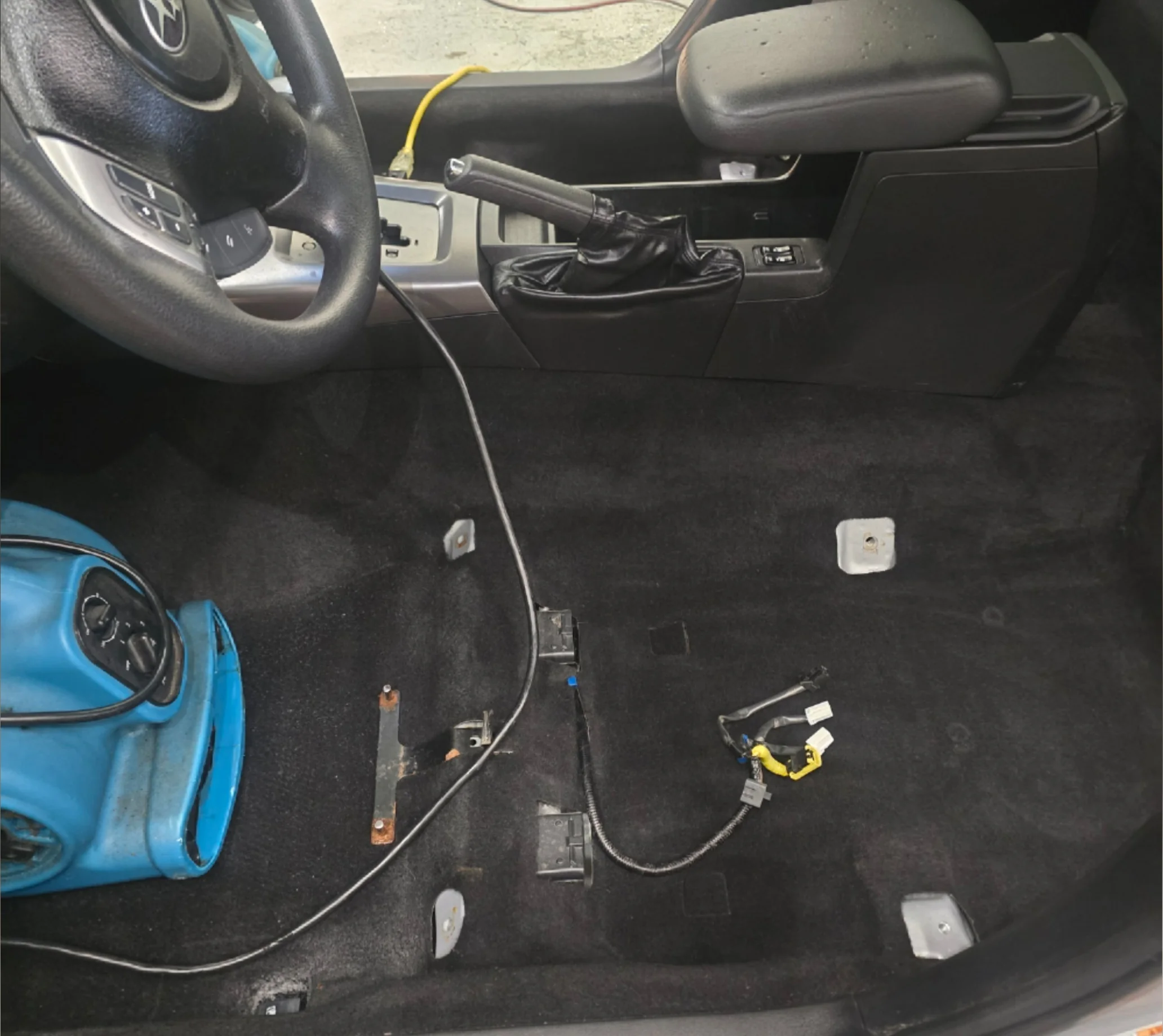 Vehicle carpet cleaned and extracted after deep stain treatment