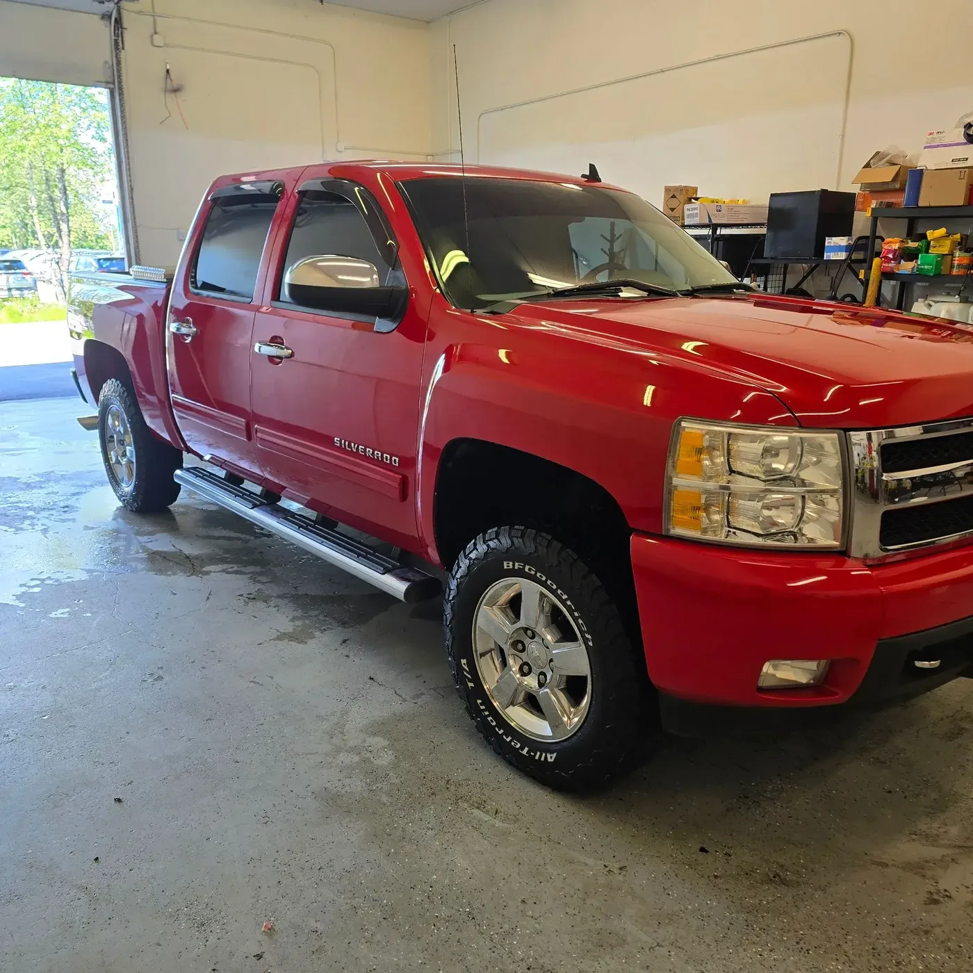 Red Chevrolet Silverado with restored gloss after a full detail by Twisted Auto Detail