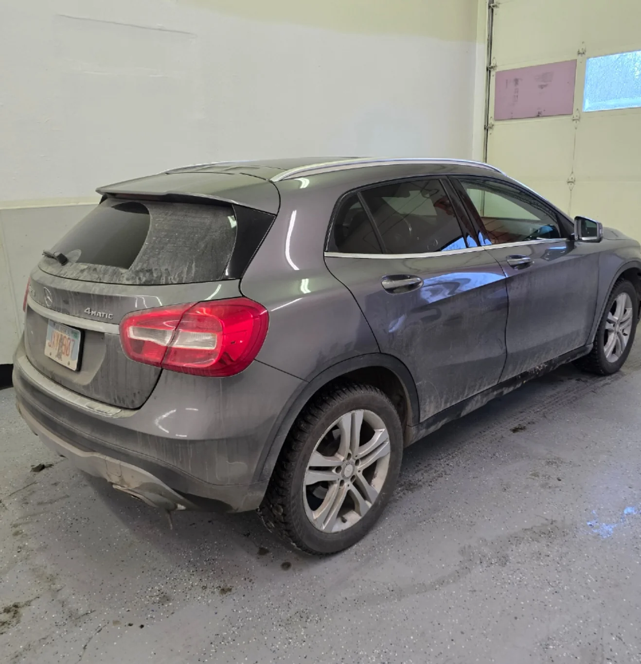 Vehicle paint covered in road film before exterior detailing in Anchorage